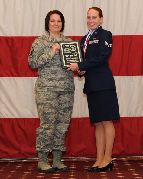 Senior Airman Alicia Freedman, 2nd Operations Support Squadron, receives the Distinguished Graduate Award from Master Sgt. Joelle Silny, Air Force Global Strike Command, on behalf of the Air Force Sergeants Association during the Airman Leadership School class 14-2 graduation on Barksdale Air Force Base, La., Feb. 13, 2014. (U.S. Air Force photo/Senior Airman Joseph A. Pagán Jr.)