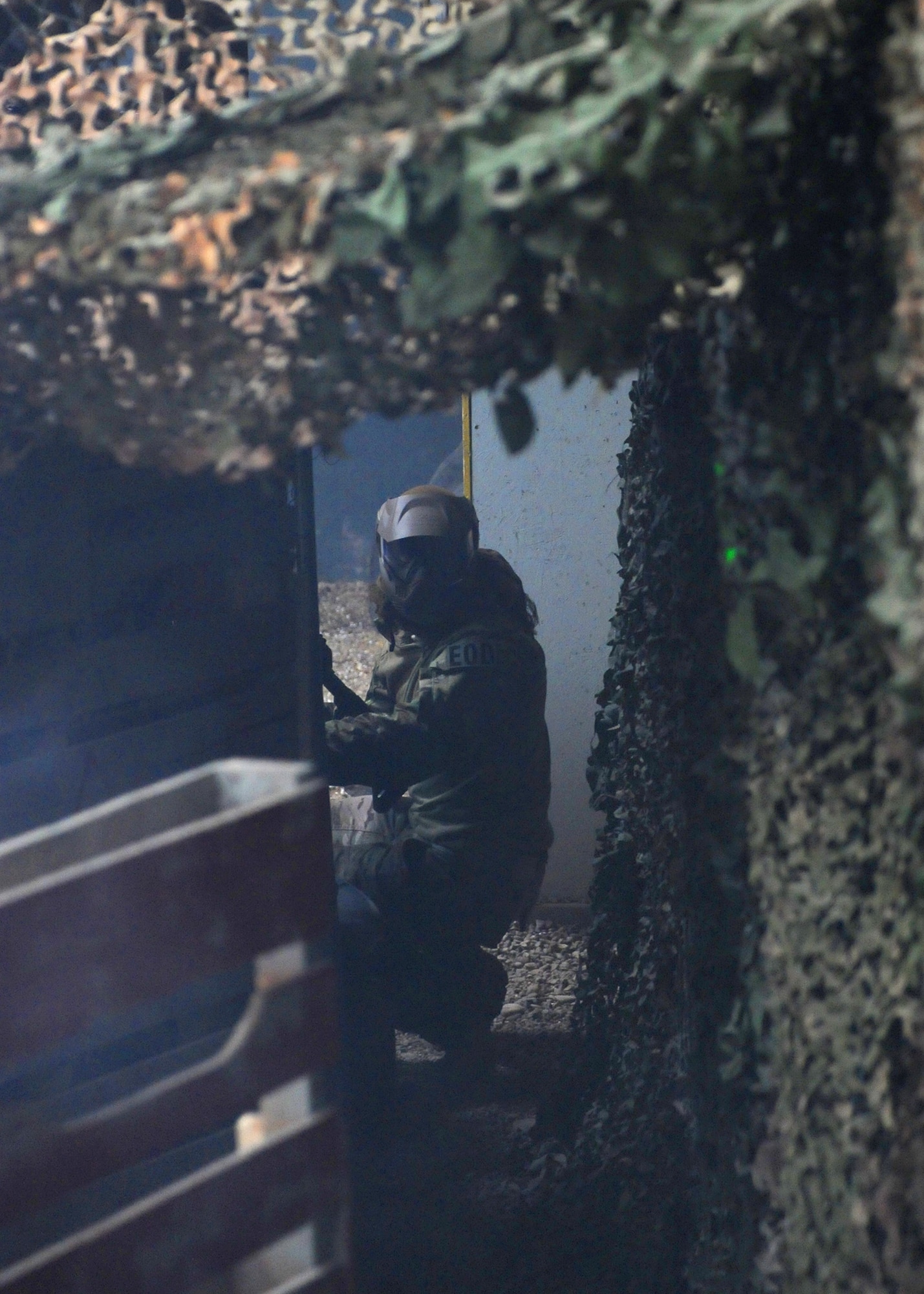 Airman 1st Class Randy Shandler, 341st Civil Engineer Squadron Explosive Ordnance Disposal technician, watches his back for opponents during an airsoft tournament. The tournament gave EOD technicians and emergency management team members tactical training as well as a fun way to build morale throughout the shops. (U.S. Air Force photo/Senior Airman Cortney Paxton)