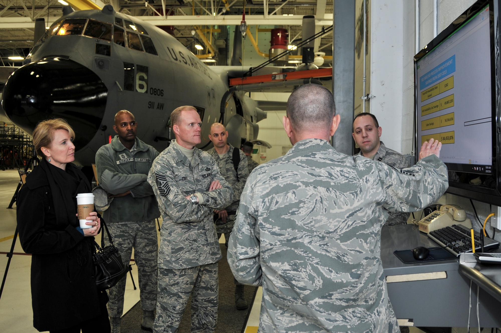 Chief Master Sgt. of the Air Force James A. Cody and his wife, Athena, are briefed on the C-130 Hercules maintenance isochronal inspection process by Chief Master Sergeant Terrance Keblish, 911th Maintenance Squadron superintendent, and Capt. David Kunca, 911 MXG commander, at the Pittsburgh International Airport Air Reserve Station, Feb. 8, 2014. The ISO process, which has saved the U.S. Air Force approximately 84 million dollars and approximately 1282 flying days, is one of several items spotlighted during Chief and Mrs. Cody’s first visit to an Air Force Reserve Base. (U.S. Air Force photo by Senior Airman Joshua J. Seybert)