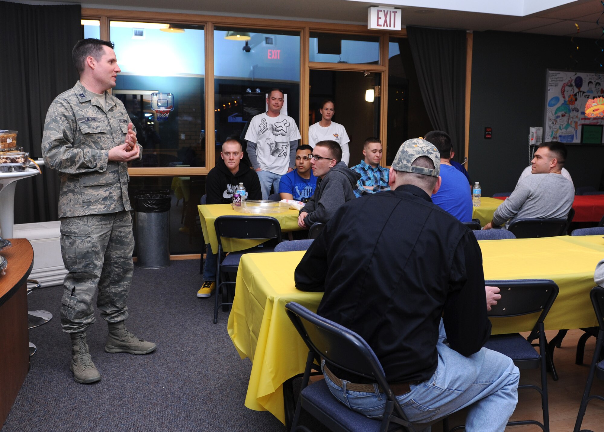 Chaplain (Capt.) Robert Mohr, 341st Missile Wing chaplain, welcomes junior enlisted Airmen to a dinner at the Malmstrom Air Force Base Detour on Feb. 18. Sponsored by Malmstrom Air Force Association Chapter 108, the free dinner was hosted to kick off the Detour’s new hours. (U.S. Air Force photo/Senior Airman Katrina Heikkinen)