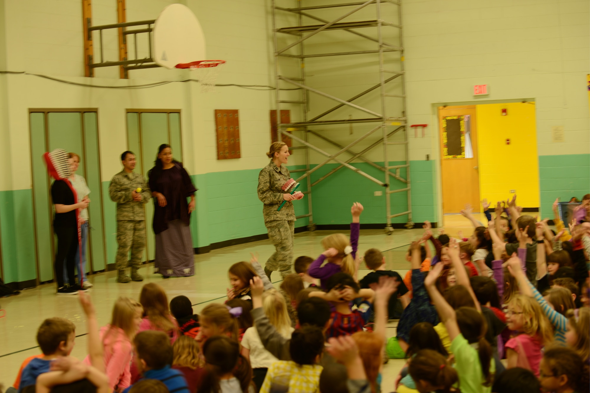 Capt. Danielle Fry, 366th Aerospace Medicine Squadron, general dentist, speaks to children from the Mountain Home Air Force Base primary school Feb. 19, 2014. Every February, the American Dental Association sponsors National Children's Dental Health Month to raise awareness about the importance of oral health. (U.S. Air Force photo by Senior Airman Benjamin Sutton/Released)
