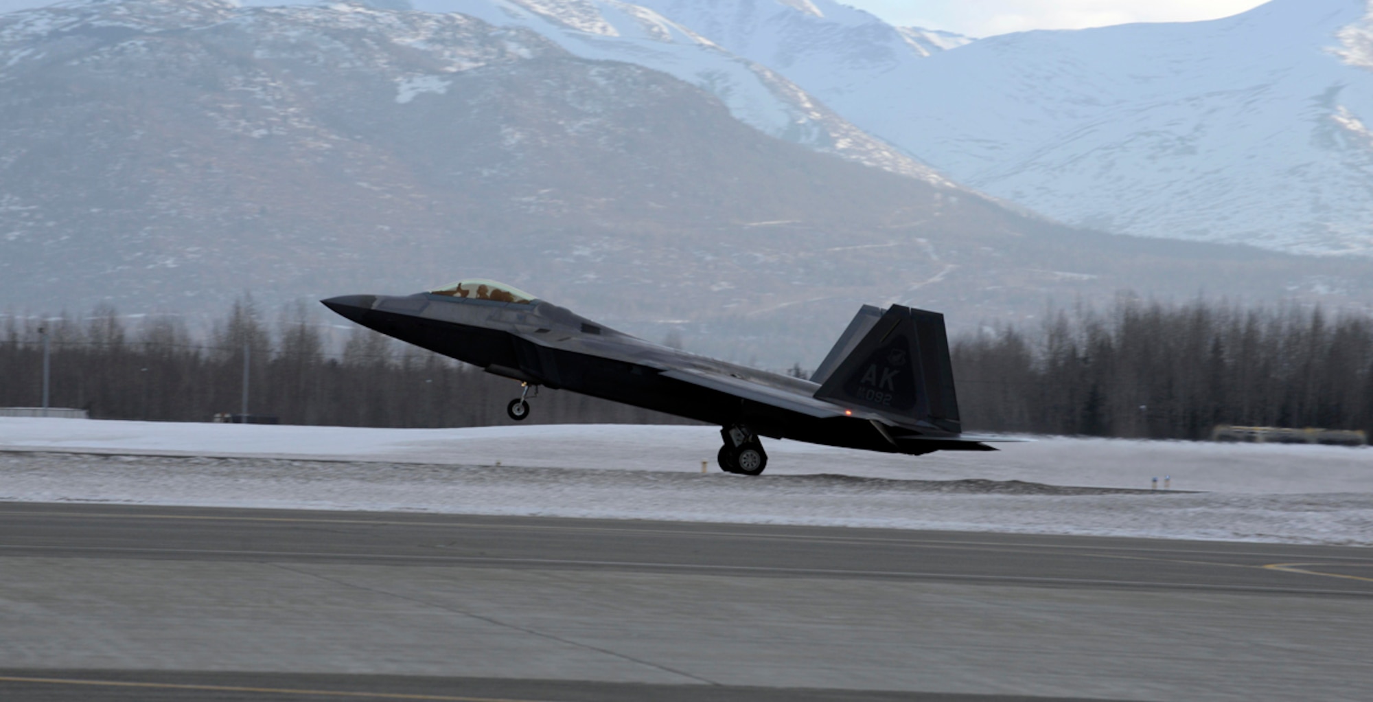 An F-22 Raptor assigned to the 90th Fighter Squadron lands on Joint Base Elmendorf-Richardson, Alaska, during a rapid raptor scenario during Exercise Polar Force 14-2, Feb. 10, 2014. During the exercise, the 3rd Wing practiced the new Rapid Raptor strategy that will enable combat-ready F-22s to rapidly refuel, rearm and redeploy. (U.S. Air Force photo/Staff Sgt. Sheila deVera)
