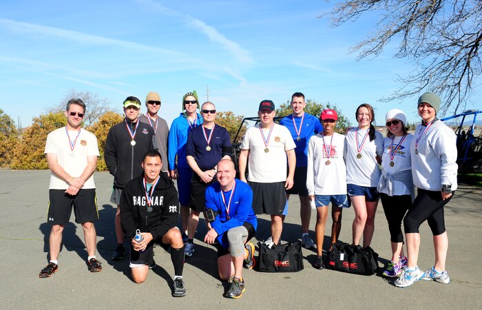Medal recipients pose for a picture after completing a Recce Challenge Adventure Series 10K run at Beale Air Force Base, Calif., Feb. 20, 2014. Lt. Col. Roger Gibson, 713th Combat Operations Squadron chief of training, ran the fastest time of 48 minutes, 23 seconds. (U.S. Air Force photo by Airman 1st Class Bobby Cummings/Released)
