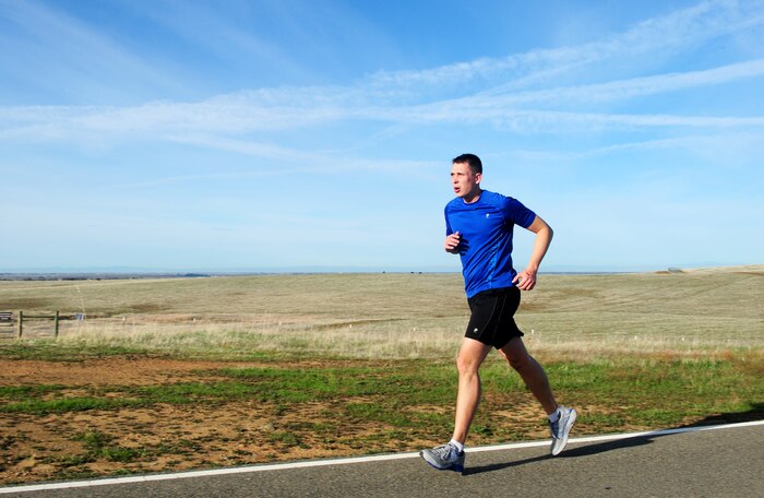 Staff Sgt. Justin Wichmann, runs up a hill at Beale Air Force Base, Calif., Feb. 20, 2014. Wichmann was a participant during the Recce Challenge Adventure Series 10K run. (U.S. Air Force photo by Airman 1st Class Bobby Cummings/Released)