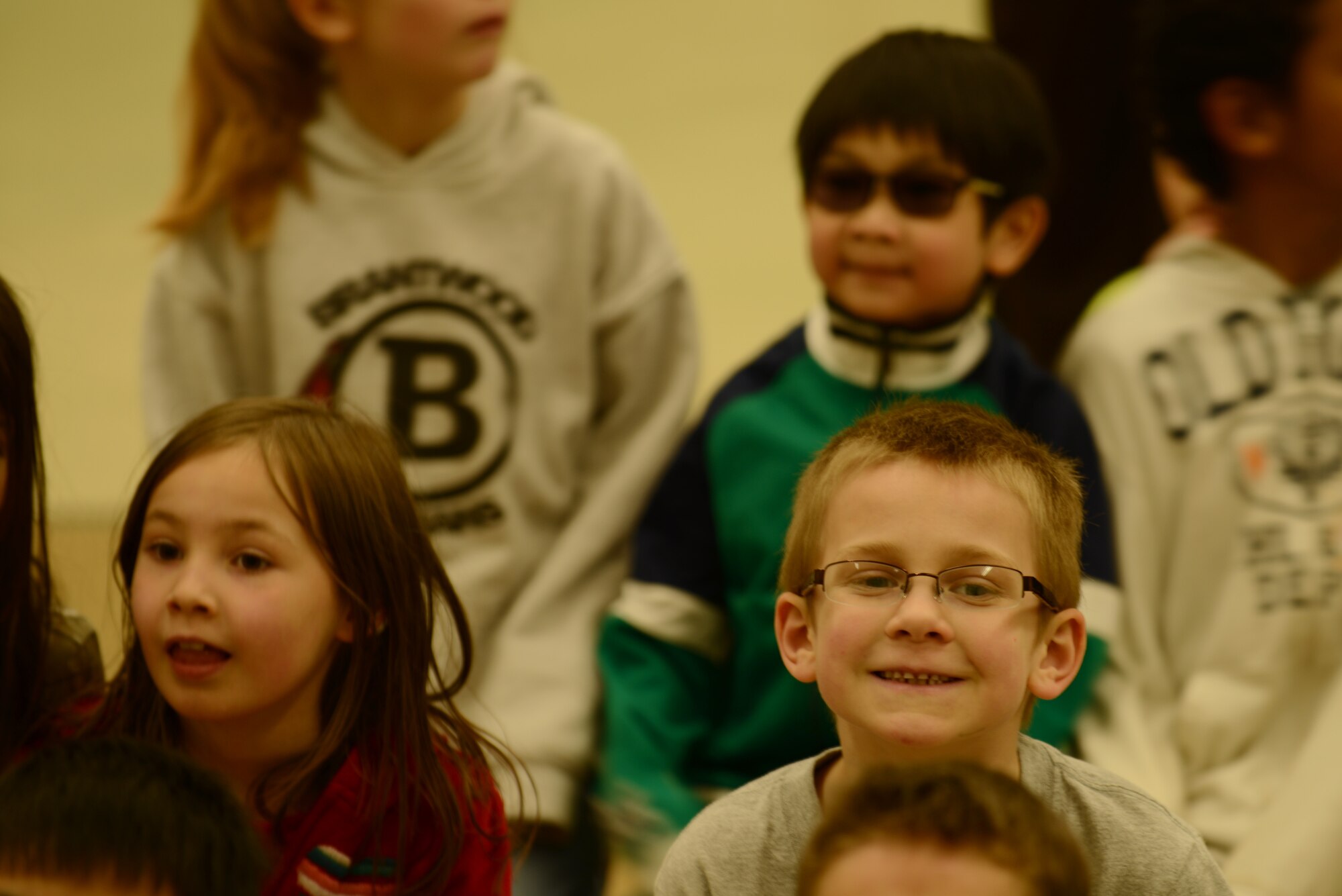 Children from the Mountain Home Air Force Base primary school gathered for a presentation Feb. 19, 2014, at Mountain Home Air Force Base, Idaho. The 366th Dental Flight performed a skit to showcase the importance of brushing and flossing daily since February is Children's Dental Health Month. (U.S. Air Force photo by Senior Airman Benjamin Sutton/Released)  
