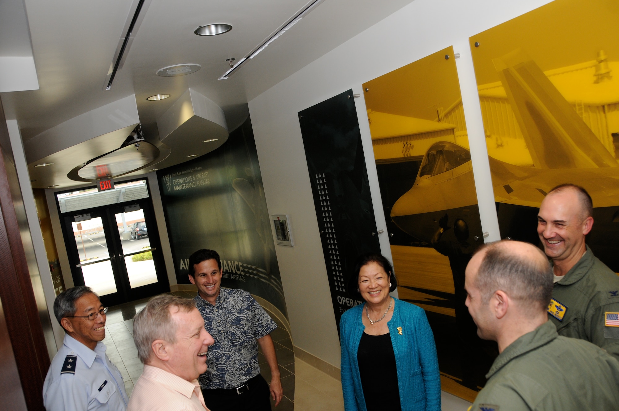 Col. Duke Pirak, 154th Operations Group commander, and Col. Michael Merritt, 15th Operations Group commander, right, provide an overview of Air Force and Air National Guard capabilities in Hawaii, Total Force Integration, and current military construction projects to Senator Richard J. Durbin (D-IL), Senator Brian E. Schatz (D-HI) and Senator Mazie K. Hirono (D-HI) at the new Joint Base Pearl Harbor-Hickam F-22 Raptor Operations and Aircraft Maintenance Complex, Feb. 18, 2014. (U.S. Air National Guard photo/Senior Master Sgt. Kristen M. Stanley)
