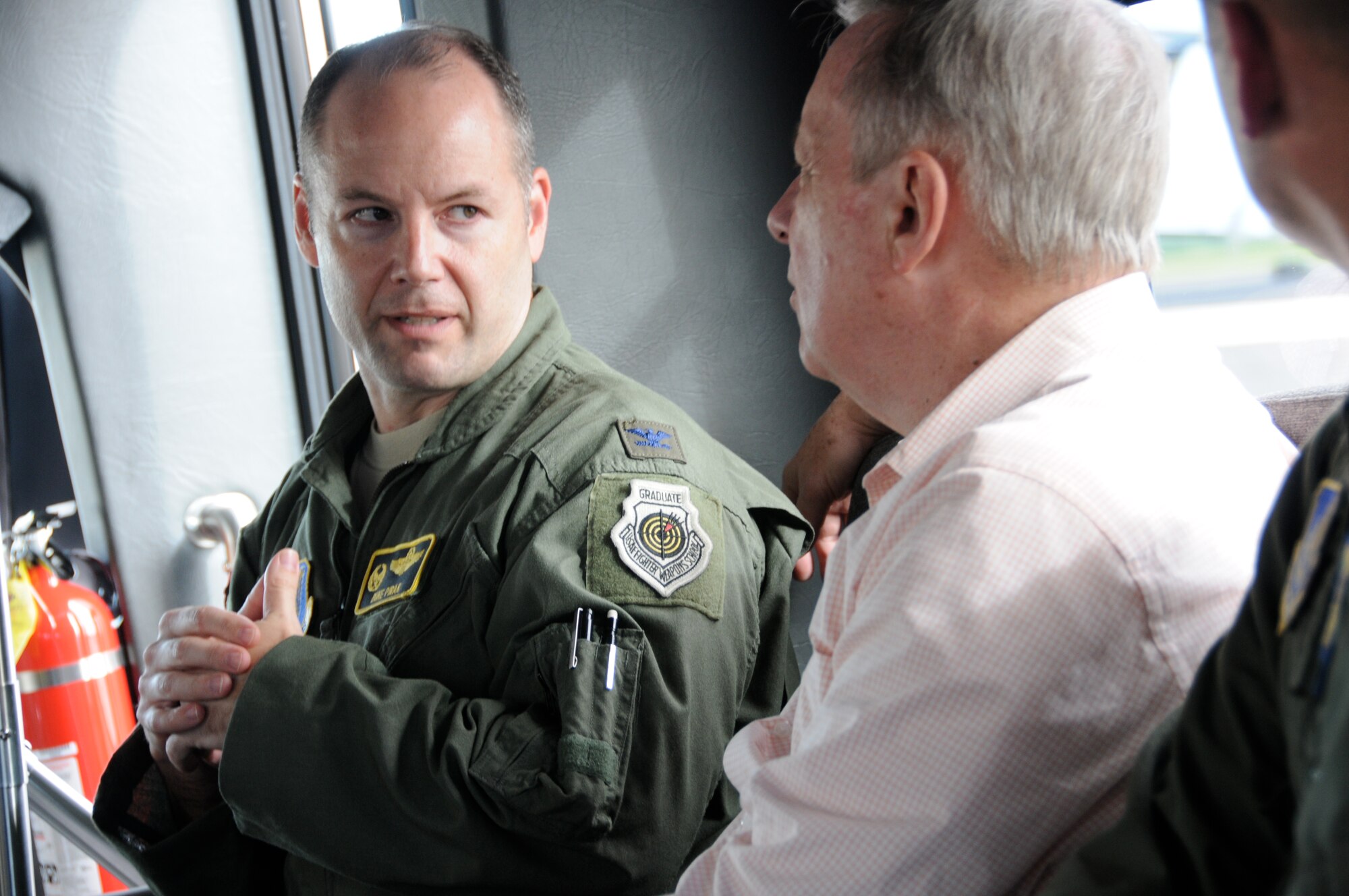 Col. Duke Pirak, 154th Operations Group commander, provides an overview of Air Force and Air National Guard capabilities in Hawaii, Total Force Integration, and current military construction projects to Senator Richard J. Durbin (D-IL) during a windshield tour of Joint Base Pearl Harbor-Hickam, Hawaii, Feb. 18, 2014. (U.S. Air National Guard photo/Senior Master Sgt. Kristen M. Stanley)