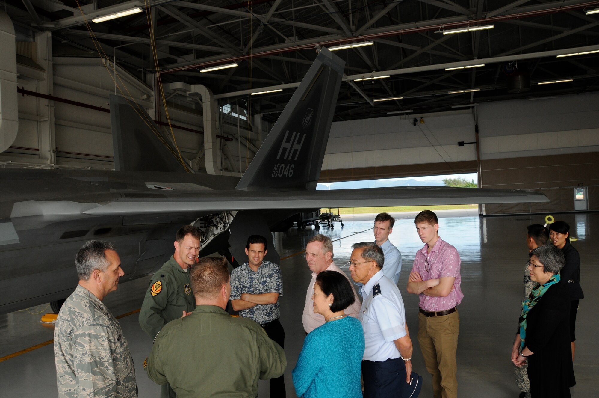 Lt. Col. Mark Ladtkow, 199th Fighter Squadron commander, and Lt. Col. James Sage, 199th Fighter Squadron director of operations, provide a brief overview of the Hawaii F-22 Raptors to Senator Richard J. Durbin (D-IL), Senator Brian E. Schatz (D-HI) and Senator Mazie K. Hirono (D-HI) at the Joint Base Pearl Harbor-Hickam, Hawaii, Feb. 18, 2014.  (U.S. Air National Guard photo/Senior Master Sgt. Kristen M. Stanley)