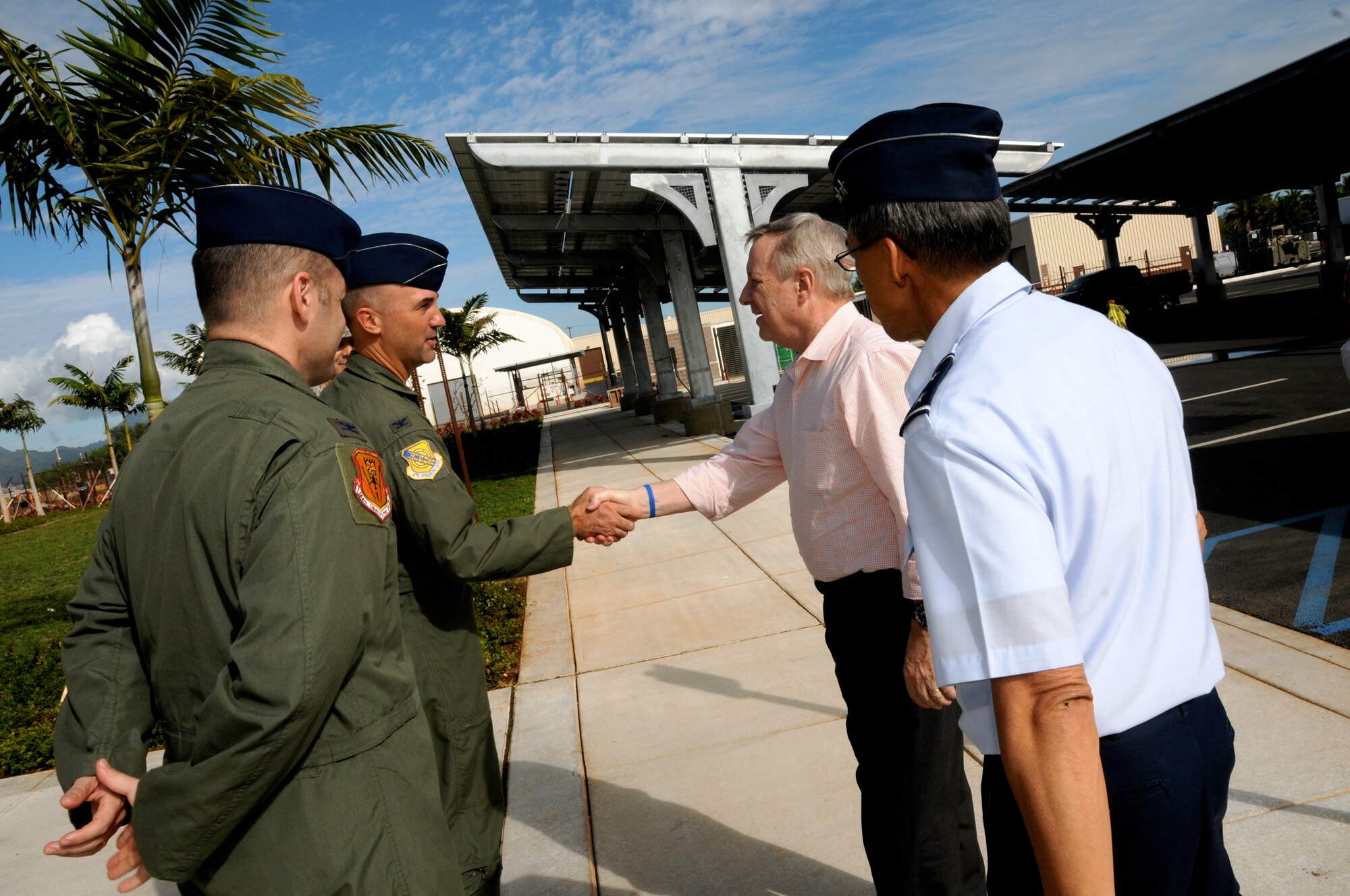 Col. Michael Merritt, 15th Operations Group commander and Col. Duke Pirak, 154th Operations Group commander, welcome Senator Richard J. Durbin (D-IL) to the new Joint Base Pearl Harbor-Hickam F-22 Raptor Operations and Aircraft Maintenance Complex, Feb. 18, 2014.  The colonels provided an overview of Air Force and Air National Guard capabilities in Hawaii, Total Force Integration and current military construction projects at JBPHH. (U.S. Air National Guard photo/Senior Master Sgt. Kristen M. Stanley)