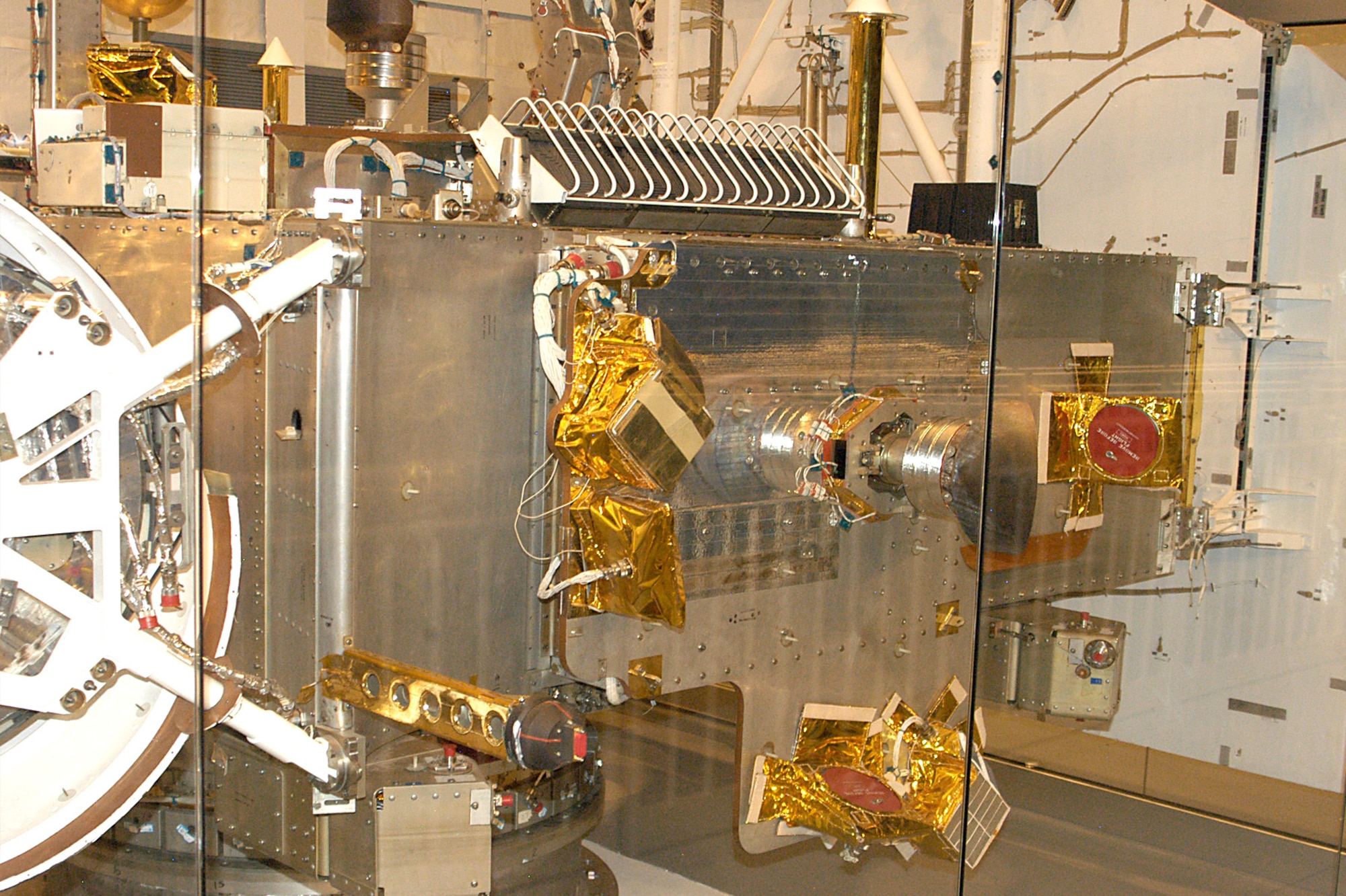 This experimental early-warning satellite was code named Teal Ruby. It was designed to test classified sensors to detect enemy aircraft crossing the polar region toward the USA during the Cold War. This would give U.S. forces early warning of nuclear attack. Teal Ruby was to be launched on a space shuttle in the 1980s, but the mission was cancelled. Instead, it became a test-bed for studying how space equipment ages in storage. (U.S. Air Force photo)