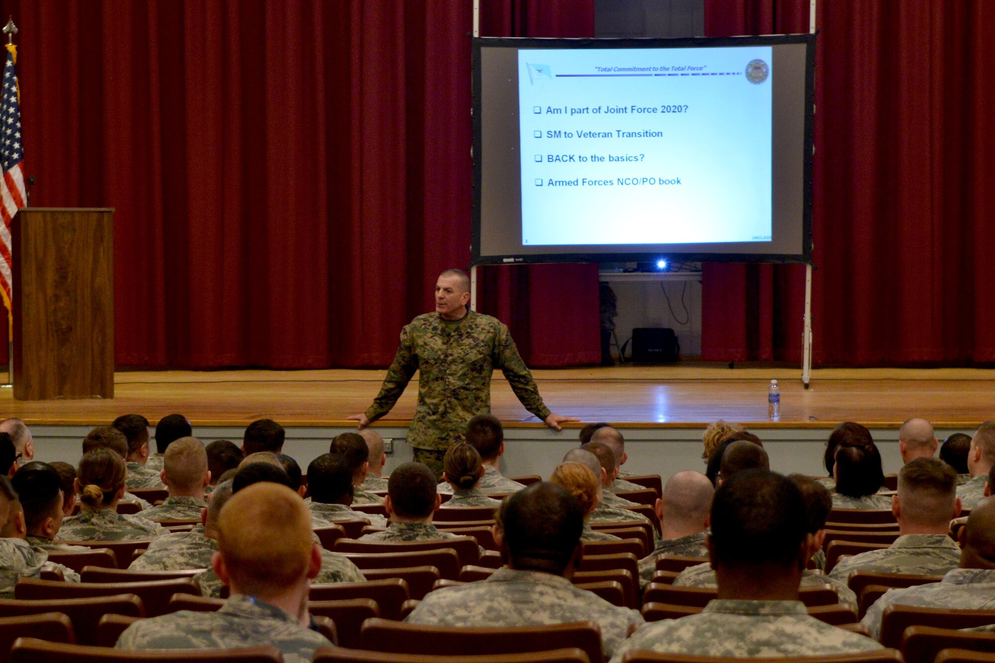U.S. Marine Corps Sgt. Maj. Bryan Battaglia, Senior Enlisted Advisor to the Chairman of the Joint Chiefs of Staff speaks to a room of Airmen and Soldiers during a town hall meeting, Shaw Air Force Base, S.C., Feb. 18, 2014. Battaglia spent the day speaking with Team Shaw members on the subject of force management as well as other military situations. (U.S. Air Force photo by Senior Airman Ashley L. Gardner/Released)