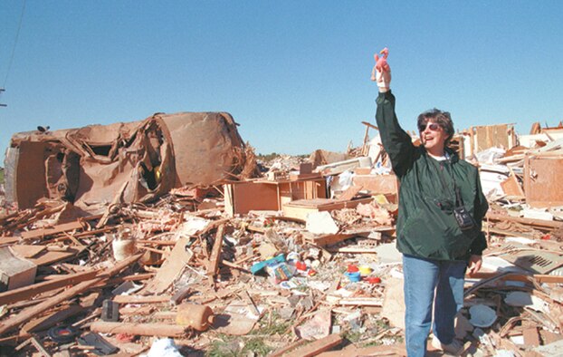 Searching through the rubble that once was her house, Becky Pillifant finds a stuffed flamingo that had been in her car before a tornado ripped through Moore and south Oklahoma City on May 3, 1999. Ms. Pillifant, a marketing specialist in the 72nd Force Support Squadron, said she has the flamingo in a shadowbox in the kitchen of her new home, which was built in the same spot as the one destroyed in 1999. (Air Force photo by Margo Wright)