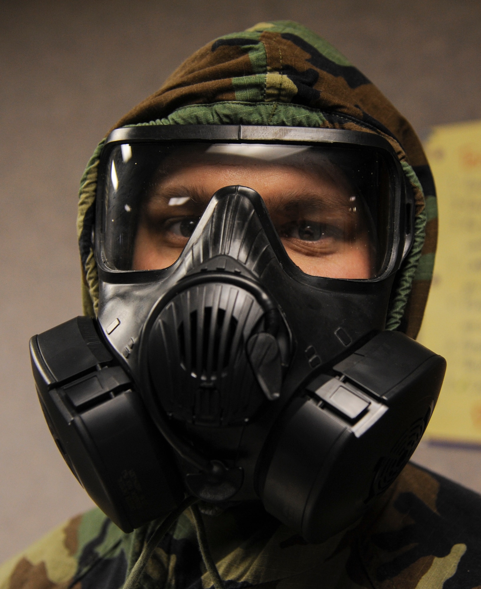 Staff Sgt. Paul Jones, a 19th Security Forces Squadron flight chief, tries on the M50 gas mask Feb. 12, 2014, at Little Rock Air Force Base, Ark. Airmen must be comfortable with mission oriented protective posture gear before a deployment. (U.S. Air Force photo by Airman 1st Class Harry Brexel)