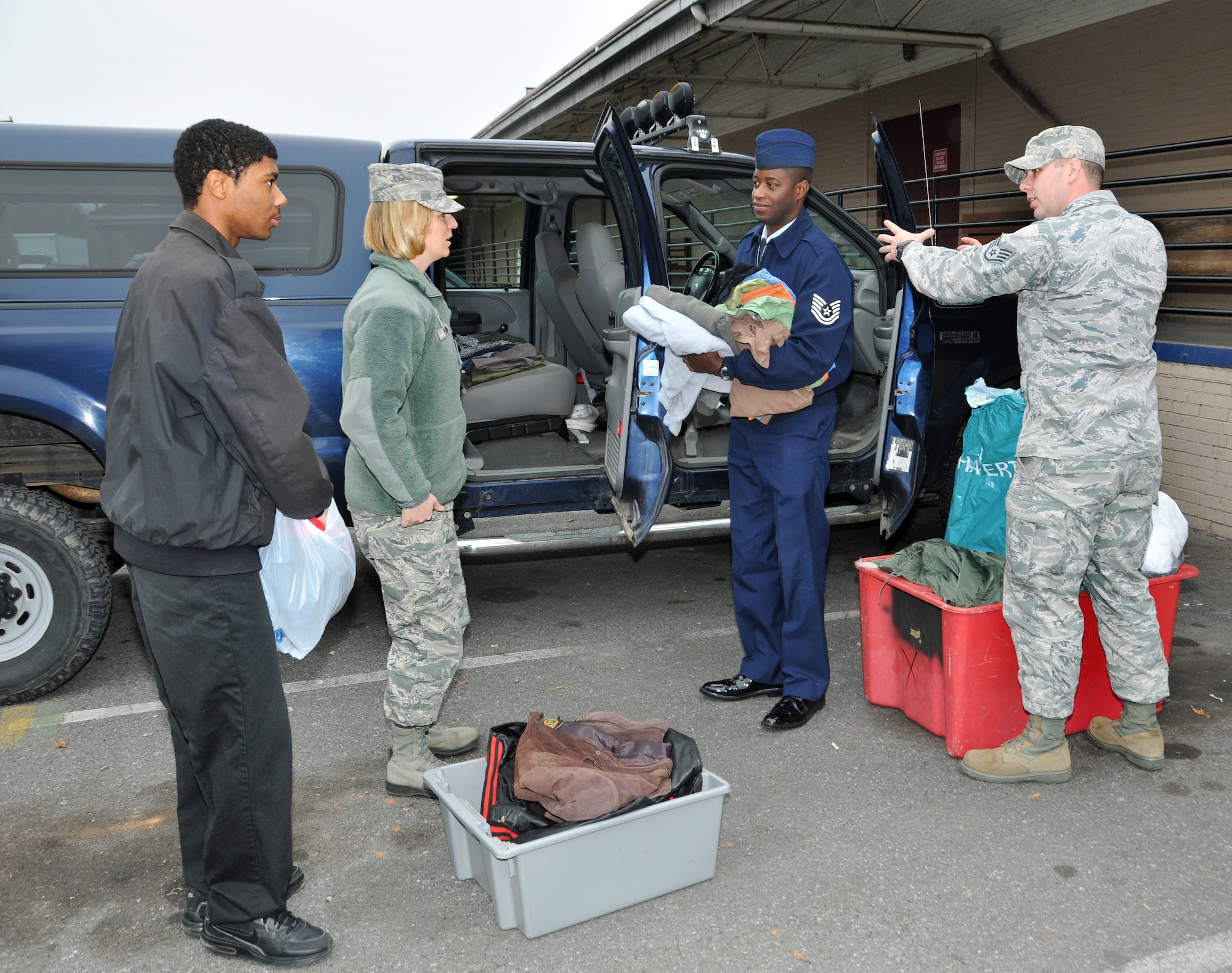 Gregory Landrum, a student from Military Global Leadership Academy, a high school located in Charlotte, N.C., sorts through winter clothing donated by members of the North Carolina Air National Guard.  Men’s coats, hats, gloves and other items were collected by 145th Airlift Wing, Chapter 7 President, Master Sgt. Tracie Rankin, Vice President, Tech. Sgt. Lonnie Brooks and Director at Large, Staff Sgt. Jessie Huneycutt and delivered to a local homeless shelter in Charlotte, N.C. just as a winter storm hits the Carolinas. (U.S. Air National Guard photo by Master Sgt. Patricia F. Moran/Released)  