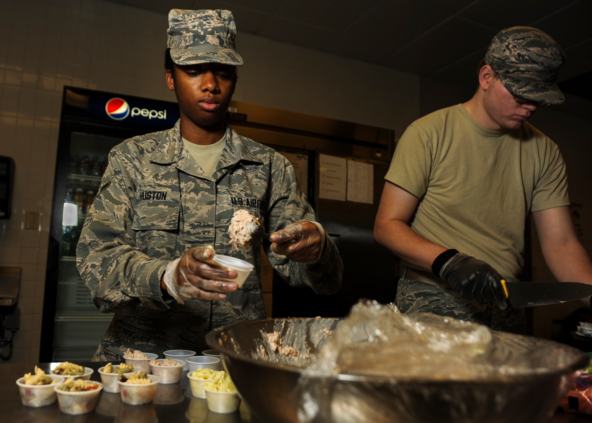 Airman Kathryn Huston, a 19th Force Support Squadron food service apprentice, prepares snacks for nighttime operations aircrew Feb. 19, 2014, at Little Rock Air Force Base, Ark. Huston recently trained with an executive chef to launch the new Chopsticks concept at the Hercules Dining Facility, highlighting Mongolian style cooking. (U.S. Air Force photo by Airman 1st Class Cliffton Dolezal)