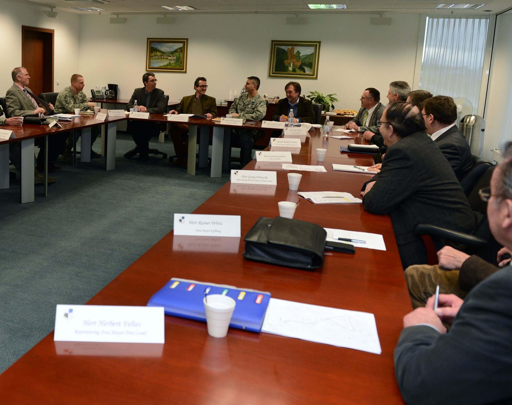 Col. David Julazadeh, 52nd Fighter Wing commander, seated center right at back table, talks with key leaders from the German community at Spangdahlem Air Base, Germany, Feb. 19, 2014. The information forum created opportunities for community leaders to voice their opinions and concerns while gathering insight on current events and operations. (U.S. Air Force photo by Airman 1st Class Kyle Gese/Released)