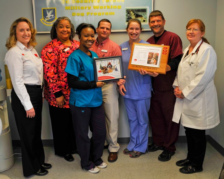 Vet clinic staff and American Animal Hospital Association practice consultant, Lisa Lopshire, pose for a photo on Barksdale Air Force Base, Feb. 7, 2014. The vet clinic, originally accredited by the AAHA in 2011, completed a recertification Feb. 7. (U.S. Air Force photo/Airman 1st Class Benjamin Raughton)