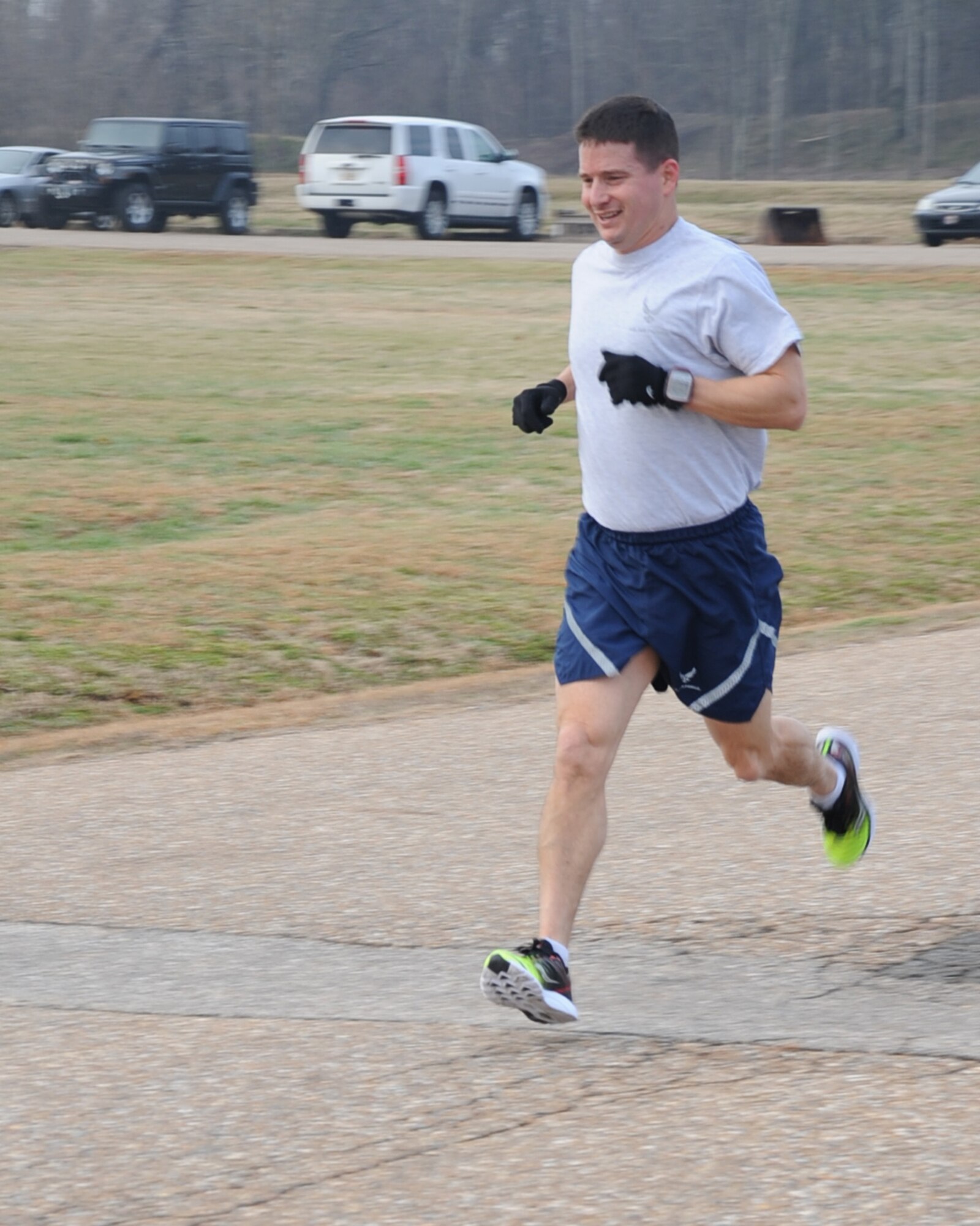 Lt. Col. Charles McElvaine, 2nd Operations Support Squadron, crosses the finish line during the Love 5K run on Barksdale Air Force Base, La., Feb. 14, 2014. McElvaine finished with a time of 17:53. (U.S. Air Force photo/Staff Sgt. Sean Martin)

