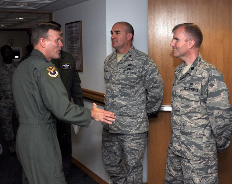 U.S. Air Force Lt. Gen. Tod Wolters, 12th Air Force commander, left, congratulates Maj. Brant Clark, 7th Comptroller Squadron and Lt. Col Patrick Dolan, Judge Advocate’s office, for both having programs that were recently recognized by Air Combat Command Feb. 13, 2014, at Dyess Air Force Base, Texas. During his visit, he toured several base facilities, hosted an all-call, met with Dyess AFB leadership, and presided over the 7th Bomb Wing change of command ceremony. (U.S. Air Force photo by Senior Airman Peter Thompson/Released)