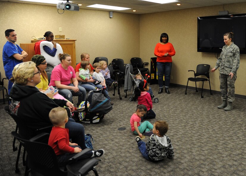Staff Sgt. Amanda Perkins, 2nd Dental Squadron registered dental hygienist, teaches children about proper oral care at the 2nd DS on Barksdale Air Force Base, La., Feb. 14, 2014. Members from the 2nd DS are promoting oral care during National Children's Dental Health Month. (U.S. Air Force photo/Senior Airman Joseph A. Pagán Jr.)