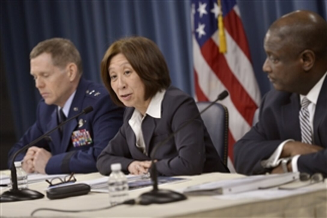 Teri Takai, center, the Defense Department's chief information officer, Air Force Maj. Gen. Robert E. Wheeler, left, the department's deputy chief information officer, and Frederick J. Moorefield Jr., right, the department's director of spectrum policy and programs, brief reporters on the department's release of its electromagnetic spectrum strategy.