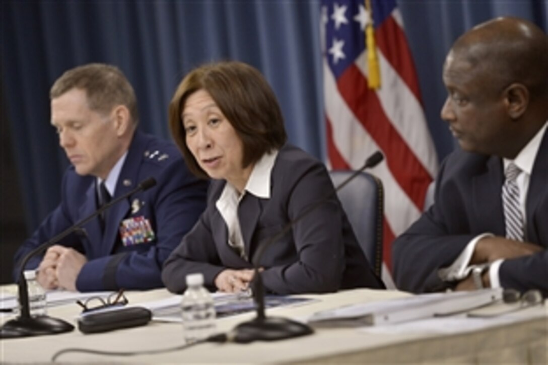 Teri Takai, center, the Defense Department's chief information officer, Air Force Maj. Gen. Robert E. Wheeler, left, the department's deputy chief information officer, and  Frederick J. Moorefield Jr., right, the department's director of spectrum policy and programs, brief reporters on the department's release of its electromagnetic spectrum strategy.