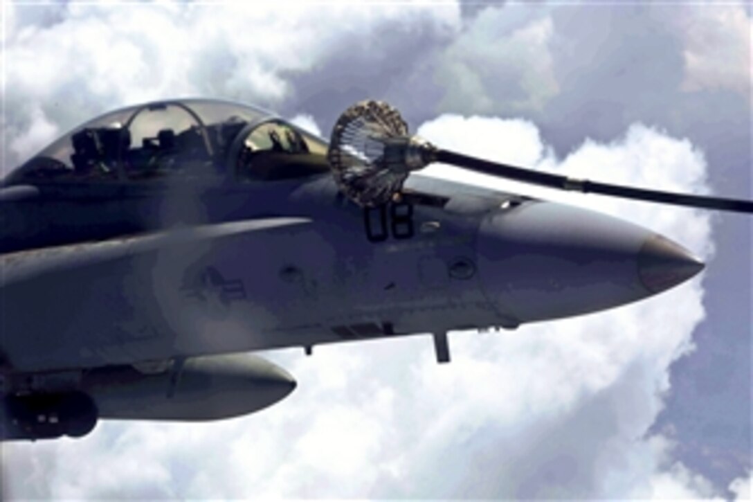 An FA-18D Hornet aircraft connects to a KC-130J Super Hercules aircraft for aerial refueling during Cobra Gold 2014 over Rayong, Thailand, Feb. 12, 2014. The Hornet pilots are assigned to Marine All Weather Fighter Attack Squadron 242, Marine Aircraft Group 12, 1st Marine Aircraft Wing, 3rd Marine Expeditionary Force. The Hercules crew is assigned to Aerial Refueler Transport Squadron 152, Marine Aircraft Group 36, 1st Marine Aircraft Wing, 3rd Marine Expaditionary Force. 