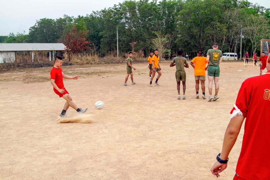 A Korean Marine attempts to score a goal during a friendly soccer game Feb. 16 at Ban Chan Krem, Kingdom of Thailand during Exercise Cobra Gold. Cobra Gold is a multinational and multiservice exercise that takes place annually in the Kingdom of Thailand and was developed by the Thai and U.S. militaries. The Royal Thai Marines are with 3rd Company, 7th Battalion of the Royal Thai Marine Corps. The U.S. Marines are with 3rd Battalion, 1st Marine Regiment currently assigned to 4th Marine Regiment, 3rd Marine Division, III Marine Expeditionary Force under the unit deployment program. (U.S. Marine photo by Lance Cpl. Stephen D. Himes/Released)