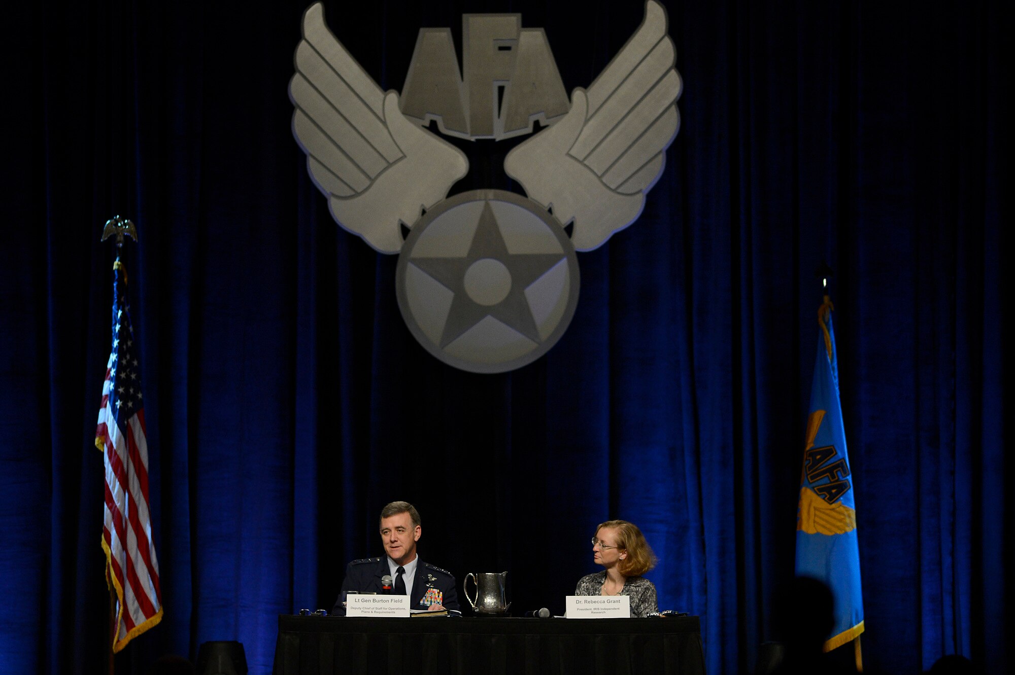 Lt. Gen. Burton Fields (left) and Dr. Rebecca Grant talk about new capabilities during their, "The Future Bomber," discussion at the 30th Annual Air Force Association Air Warfare Symposium and Technology Exposition in Orlando, Fla., Feb. 20, 2014.  Field said as the technological climate of war advances, the new long-range strike bomber will need the capability to combat new threats. Field is the deputy chief of staff for operations, plans and requirements. Grant is the president of  IRIS Independent Research. (U.S. Air Force photo/Scott M. Ash)