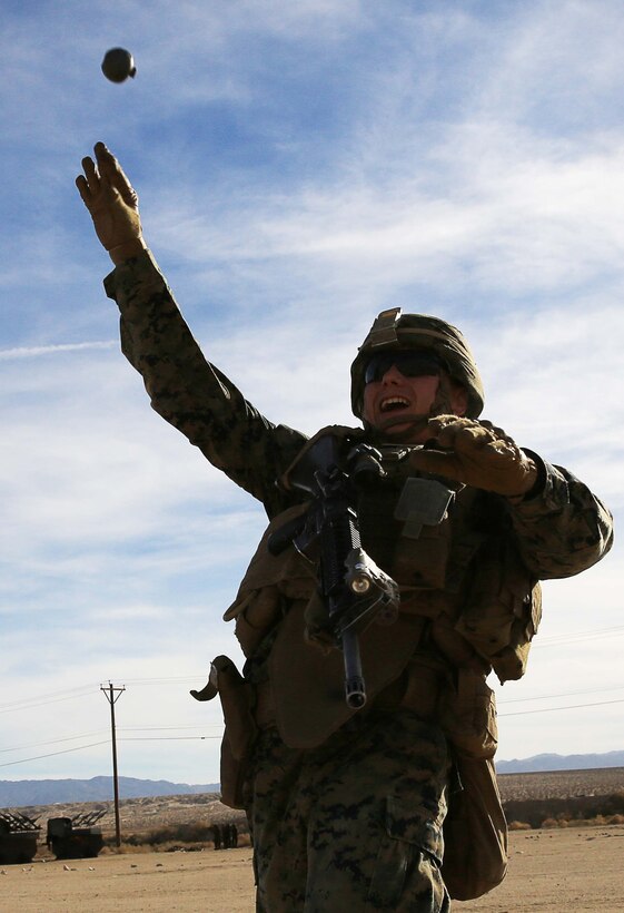 A Marine with Company E, 2nd Battalion, 7th Marine Regiment, tosses a hand grenade aboard Range 701 as part of a company squad competition aboard the Combat Center Feb. 12, 2014. The competition pitted squads within the company against each other in different Marine Corps infantry skills.


