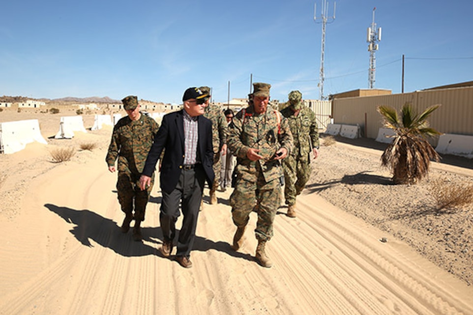 The Honorable Mr. Dennis McGinn, Assistant Secretary of the Navy, Energy, Installations, and Environment, gets an overview of the Integrated Training Exercise from Col. Andrew Kennedy, director, Tactical Training Exercise Control Group, at Range 210, Feb. 12, 2014.