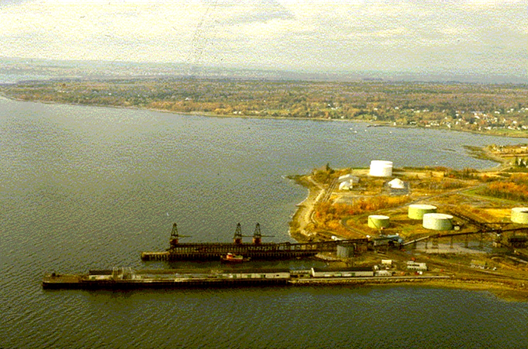 Aerial view of Searsport Harbor, Searsport, Maine, which is located on Penobscot Bay, about four miles northeast of Belfast Harbor and 26 miles north of Rockland Harbor. The project was completed in 1964 by the U.S. Army Corps of Engineers, and consists of an access channel, 35-feet deep and 500-feet wide, west of Sears Island; and a 35-feet deep turning basin extending from the end of the access channel to the piers at Mack Point. The turning basin has a maximum width of 1,500 feet.
