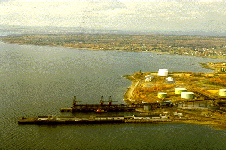 Aerial view of Searsport Harbor, Searsport, Maine, which is located on Penobscot Bay, about four miles northeast of Belfast Harbor and 26 miles north of Rockland Harbor. The project was completed in 1964 by the U.S. Army Corps of Engineers, and consists of an access channel, 35-feet deep and 500-feet wide, west of Sears Island; and a 35-feet deep turning basin extending from the end of the access channel to the piers at Mack Point. The turning basin has a maximum width of 1,500 feet.
