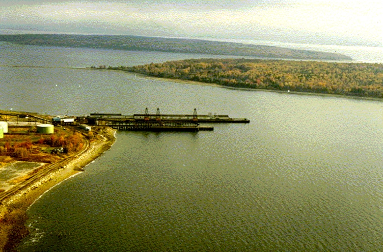 Aerial view of Searsport Harbor, Searsport, Maine, which is located on Penobscot Bay, about four miles northeast of Belfast Harbor and 26 miles north of Rockland Harbor. The project was completed in 1964 by the U.S. Army Corps of Engineers, and consists of an access channel, 35-feet deep and 500-feet wide, west of Sears Island; and a 35-feet deep turning basin extending from the end of the access channel to the piers at Mack Point. The turning basin has a maximum width of 1,500 feet.
