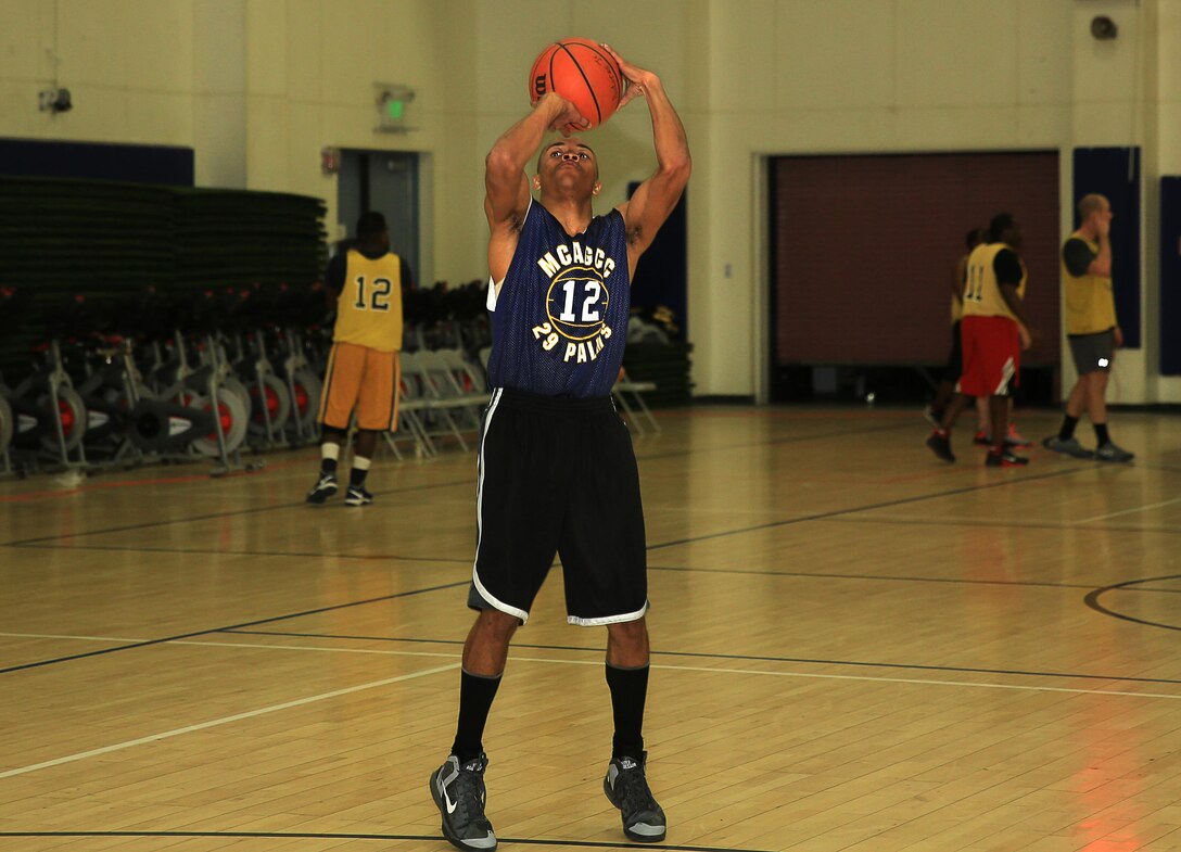 A Marine with the 1st Tank Battalion basketball team prepares to shoot during a basketball game at the East Gym, Feb. 6, 2014. The newly-started basketball league is scheduled to last through the coming months until the championship in August.


