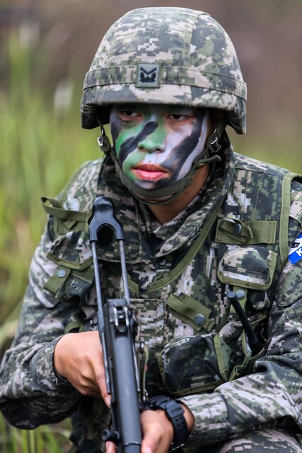 A Republic of Korea Marine gets in position to provide security during a combined arms live-fire exercise as part of exercise Cobra Gold in Training Center Ban Chan Krem, Kingdom of Thailand, Feb. 21. Cobra Gold, in its 33rd iteration, demonstrates Kingdom of Thailand, U.S. and other participating nation commitment to regional partnership, prosperity and security in the Asia-Pacific region. The CALFEX is a field exercise which consisted of Royal Thai, Republic of Korea, and U.S. Marine infantry, mechanized infantry, and air assests to demonstrate unique capabilities of a multinational force.