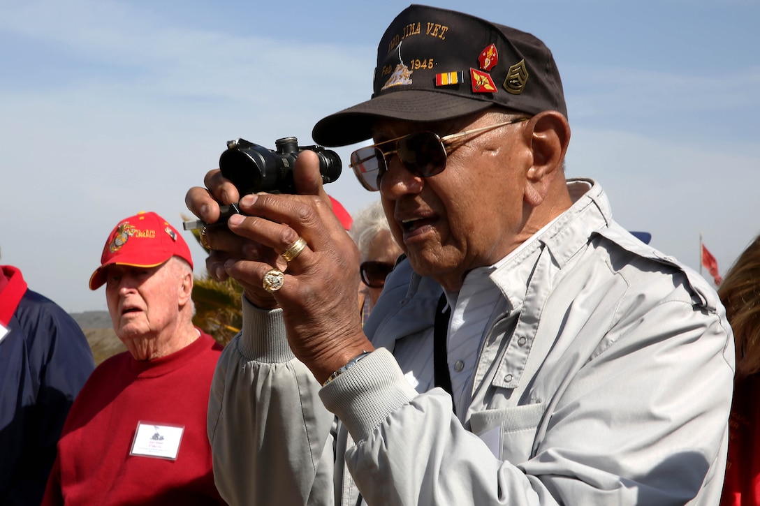 Retired GySgt. Damaso Sutis looks through a rifle combat optic at Edson Range during his tour of Camp Pendleton Feb. 20. Sutis is a veteran of the Battle of Iwo Jima. 

Iwo Jima veterans and their friends and family visited the base to commemorate the 69th anniversary of the Battle of Iwo Jima. During their tour the guests visited Assault Craft Unit 5, Edson Range, and the Marine Corps Exchange and ate at the chow hall. Many of the veterans visit Camp Pendleton every year to attend the attle of Iwo Jima commemoration.

Camp Pendleton will host the 69th anniversary of the Battle of Iwo Jima commemoration at 4:30 p.m. Feb. 22. The public portion of the commemoration will consist of a sunset memorial service at the Iwo Jima monument outside of the Pacific Views Event Cener.
