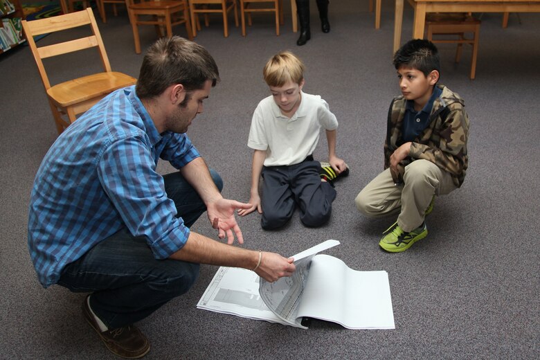 SAVANNAH, Ga. – As part of National Engineers Week, members of the U.S. Army Corps of Engineers visited May Howard Elementary school to talk to about 70 students about science and engineering. Phil Smith, Bryan Robinson (pictured), 1st Lt. Bradley Hannon, 1st Lt. Thomas Page and 1st Lt. Chet Kraft talked about careers in geotechnical engineering, structural engineering, architecture, hydrology, natural resource management, and mechanical and electrical engineering. National Engineers Week is a nationwide observance focused on increasing public dialogue about the need for engineers and celebrating how engineers make a difference in the world. USACE photo by George Jumara.