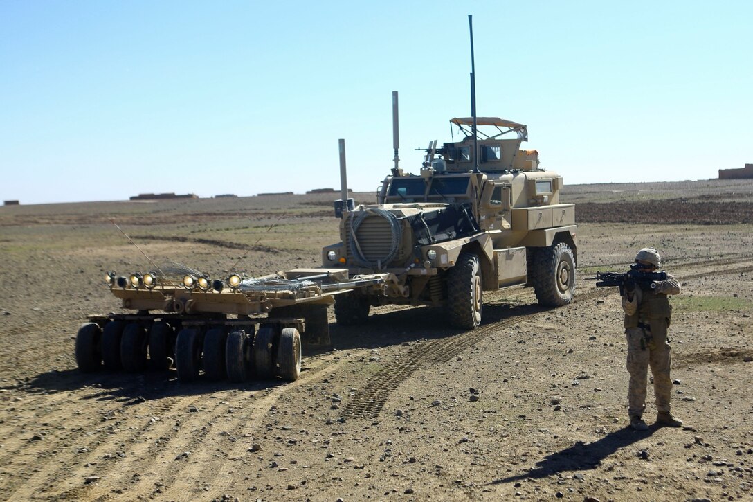 U.S. Marine Corps Lance Cpl. Diamond Aranda, an assaultman with India Co., 3rd Battalion, 7th Marine Regiment provides security during a downed vehicle recovery in Now Zad district, Helmand province, Afghanistan, Feb. 16, 2014. The Marines supported Afghan forces who were conducting an operation in the area. (U.S. Marine Corps photo by Cpl. Sean Searfus/ Released)