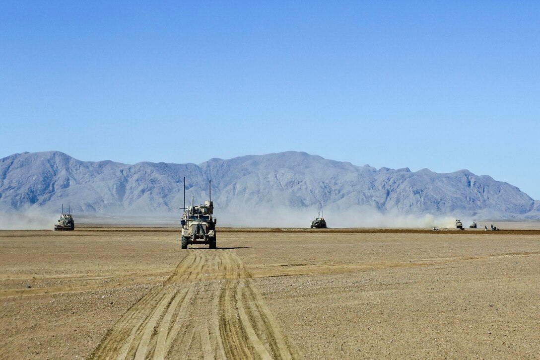 U.S. Marine Corps Mine-Resistant Ambush-Protected vehicles with 3rd Battalion, 7th Marine Regiment patrol in Now Zad district, Helmand province, Afghanistan, Feb. 17, 2014. The Marines supported Afghan  forces who were conducting an operation in the area. (U.S. Marine Corps photo by Cpl. Sean Searfus/ Released)