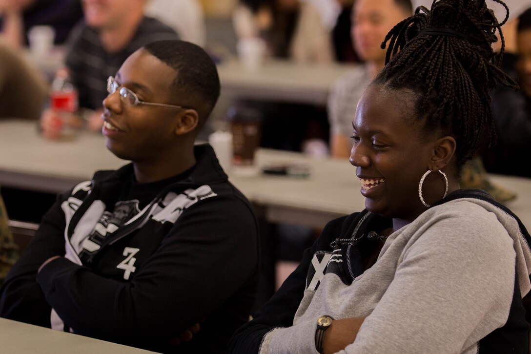 Bianca Hawkins and her husband, Lance Cpl. Omar Hawkins, react to a joke told by Cmdr. Ray Bailey during a “P.S., before you say I do” seminar at the Blinder Memorial Chapel, Feb. 19. The Naval Hospital Camp Pendleton hosted the seminar to educate Marines, sailors and their significant others about potential stressors and difficulties that could arise during the early stages of marriage. Omar is a warehouse clerk with Headquarters and Support Battalion. Bailey is the deputy command chaplain for Marine Corps Installations West. 