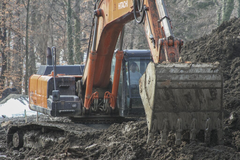 ARLINGTON, Va. -- Construction crews move dirt and prepare the ground at the Arlington National Cemetery Millennium Expansion Project, Feb. 19, 2014. The 27-acre project will add nearly 30,000 burial and niche spaces with a mix of above-ground columbariums and in-ground burials. The project also involves restoring an impaired stream that runs through the area. (U.S. Army photo/Patrick Bloodgood)