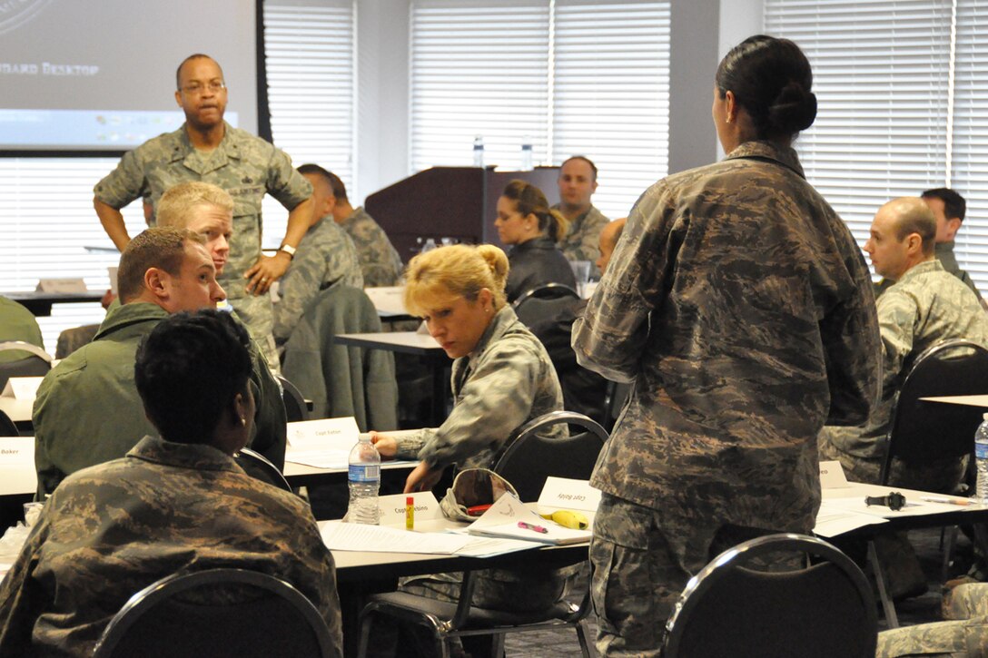 Capt. Lydia Chebino, an individual mobilization augmentee for the 618th Air and Space Operations Center, Scott Air force Base, describes her career as an IMA to Brig. Gen. Curtis Williams, 22nd Air Force vice commander, during a Junior Officer Leadership Development Seminar at Dobbins Air Reserve Base, Ga. Feb. 21. JOLDS are designed to train company grade officers in leadership, teambuilding, cultural diversity, mobilization issues and military officership. (U.S. Air Force photo/Airman 1st Class Miles Wilson)