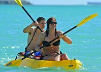 Airmen from the 96th Air Refueling Squadron participate in a kayak race during the 96th ARS Wingman Day at Hickam Beach on Joint Base Pearl Harbor-Hickam, Hawaii, Feb. 20, 2014. The event featured a variety of team-building activities that gave Airmen the chance to show their collaboration skills. (U.S. Air Force photo/Master Sgt. Jerome S. Tayborn)