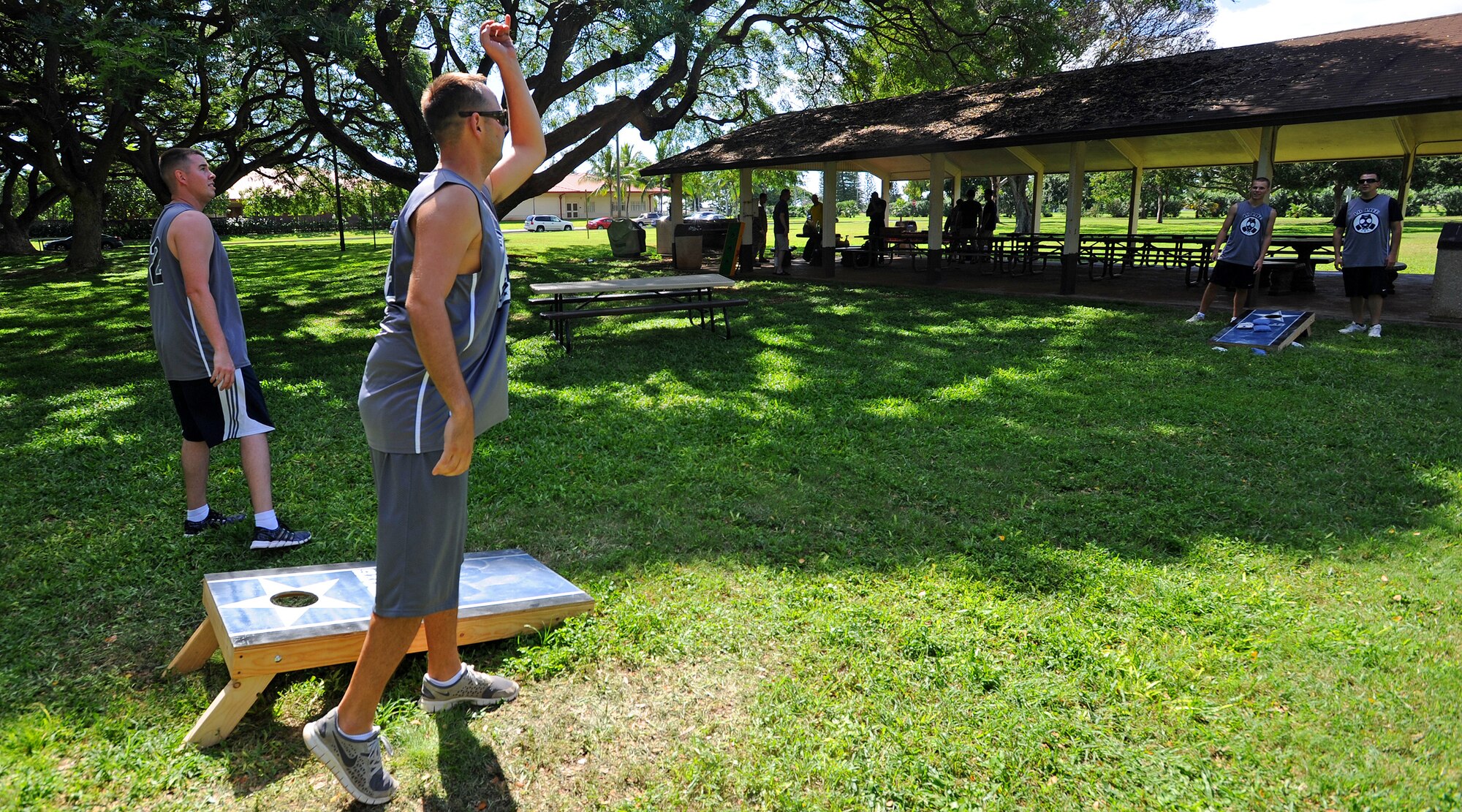 Airmen from the 15th Maintenance Group compete in a corn-hole competition during the group’s Wingman Day at Joint Base Pearl Harbor-Hickam, Hawaii, Feb. 20, 2014. Wingman Day reminds Airmen the importance of communication and integrity. (U.S. Air Force photo/Master Sgt. Jerome S. Tayborn)