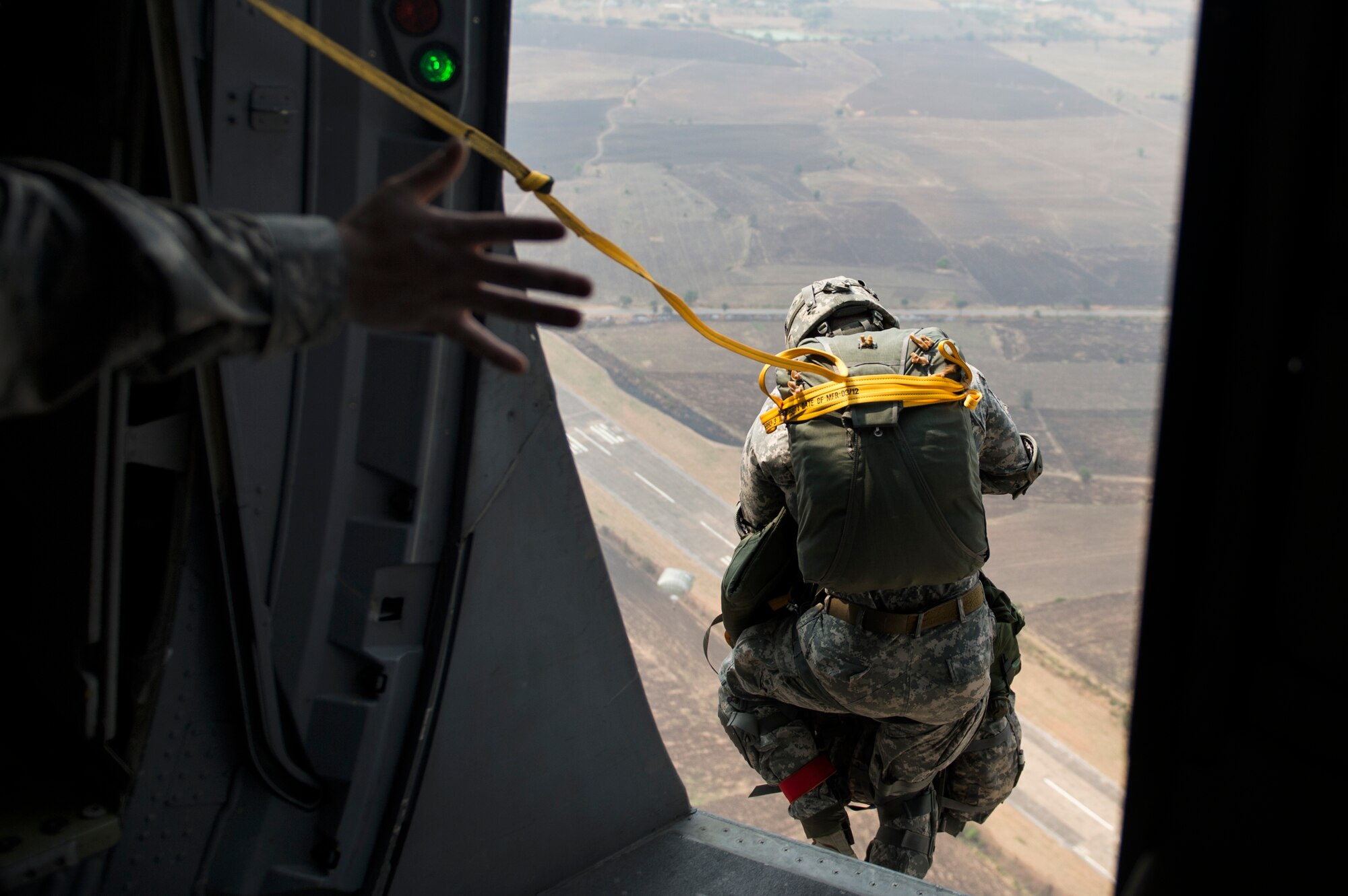 U.S. Army First Sgt. Herbert Gill, assigned to the 4th Infantry Brigade Combat Team (Airborne), 25th Infantry Division, jumps into Lopburi, Thailand for Operation Cobra Gold 2014, Jan. 14, 2014.  CG14  in its 33rd iteration, demonstrates the U.S. and the Kingdom of Thailand's commitment to their long-standing alliance and regional partnership, prosperity and security in the Asia-Pacific region.  (U.S. Air Force photo by Senior Airman James Richardson)