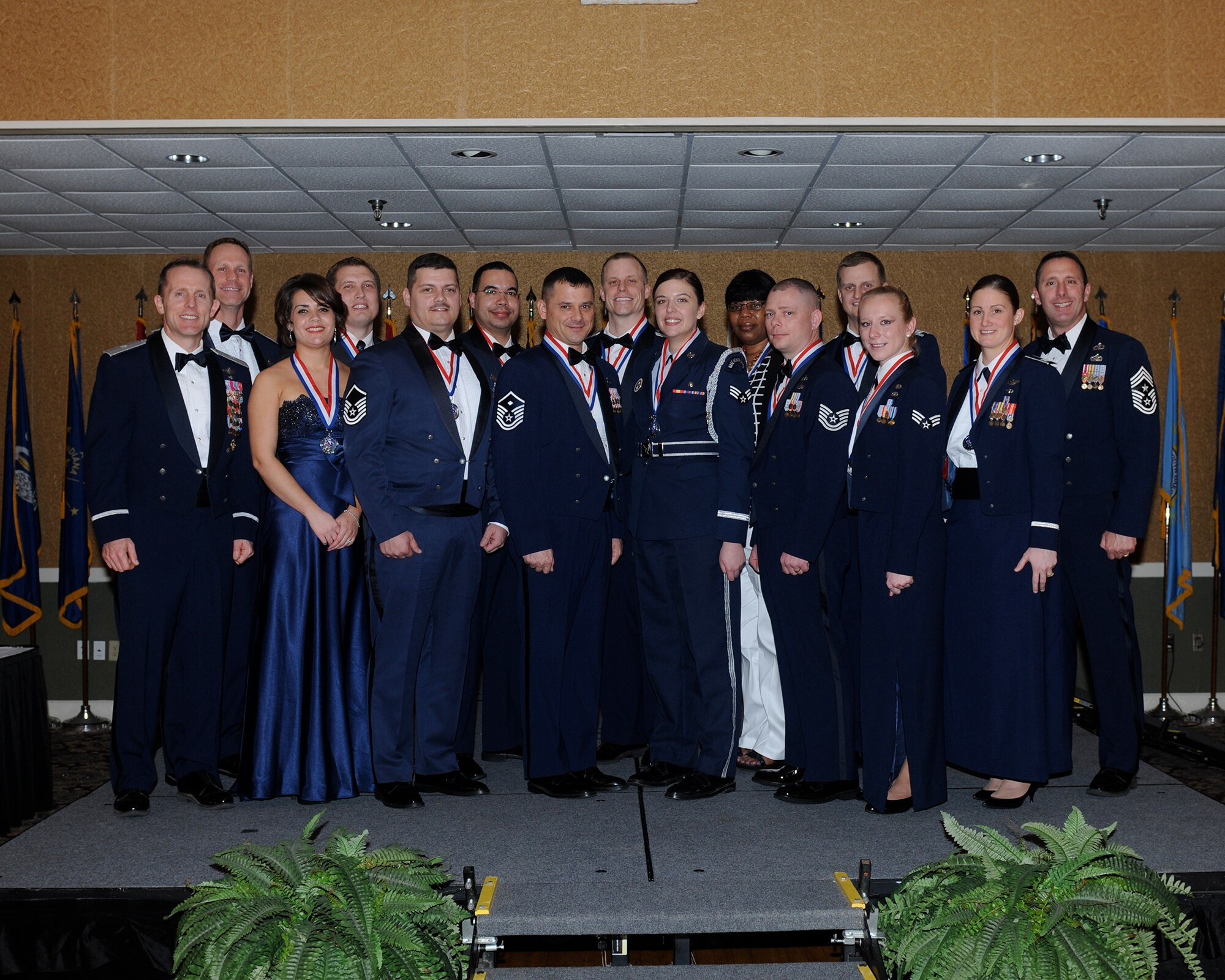 Winners of the 2013 Annual Awards ceremony pause for a photo with Brig. Gen. John Cherrey, Deputy Director of Intelligence, Operations, and Nuclear Integration for Flying Training, Headquarters Air Education and Training Command and was the guest speaker for the event, Col. Jim Sears, 14th Flying Training Wing Commander, and Chief Master Sgt. Vance Kondon, 14th FTW Command Chief, at the Columbus Club Feb. 20.