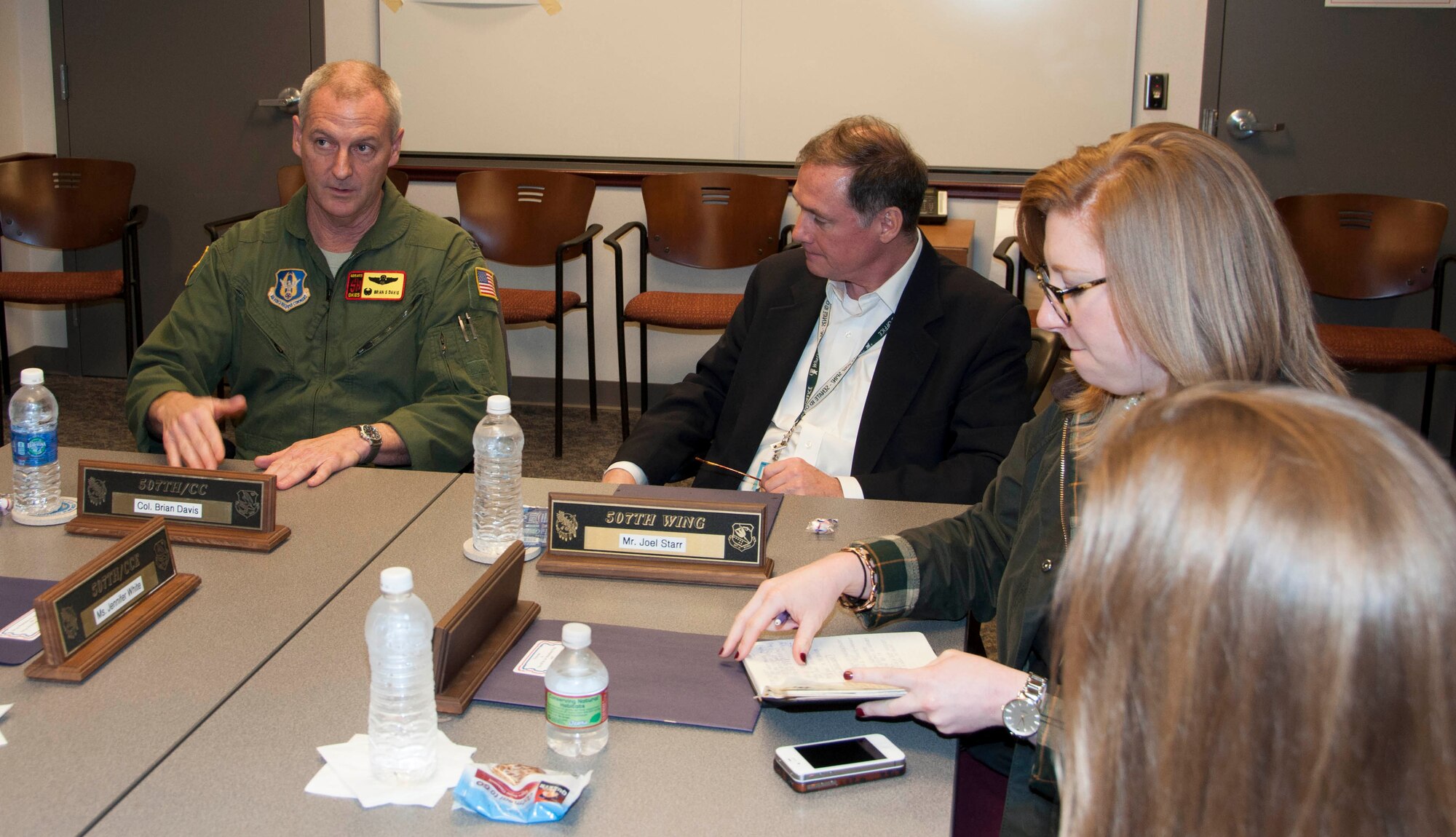 Colonel Brian Davis, 507th Air Refueling Wing commander, left, briefs Mr. Joel Starr, military and foreign affairs counsel, office of Senator Jim Inhofe and other members of the Oklahoma Military Legislative Assistants and Staff Delegation members here Feb. 20, 2014.  Davis and other members of the 507th and 137th Oklahoma Air National Guard ARWs explained to the distinguished visitors how the reserve and guard have managed the total force integration so successfully.  The briefing in the 507th AMXS conference room was the final stop for the members, who toured Tinker AFB earlier in the day.  (U.S. Air Force photo/Senior Airman Mark Hybers)