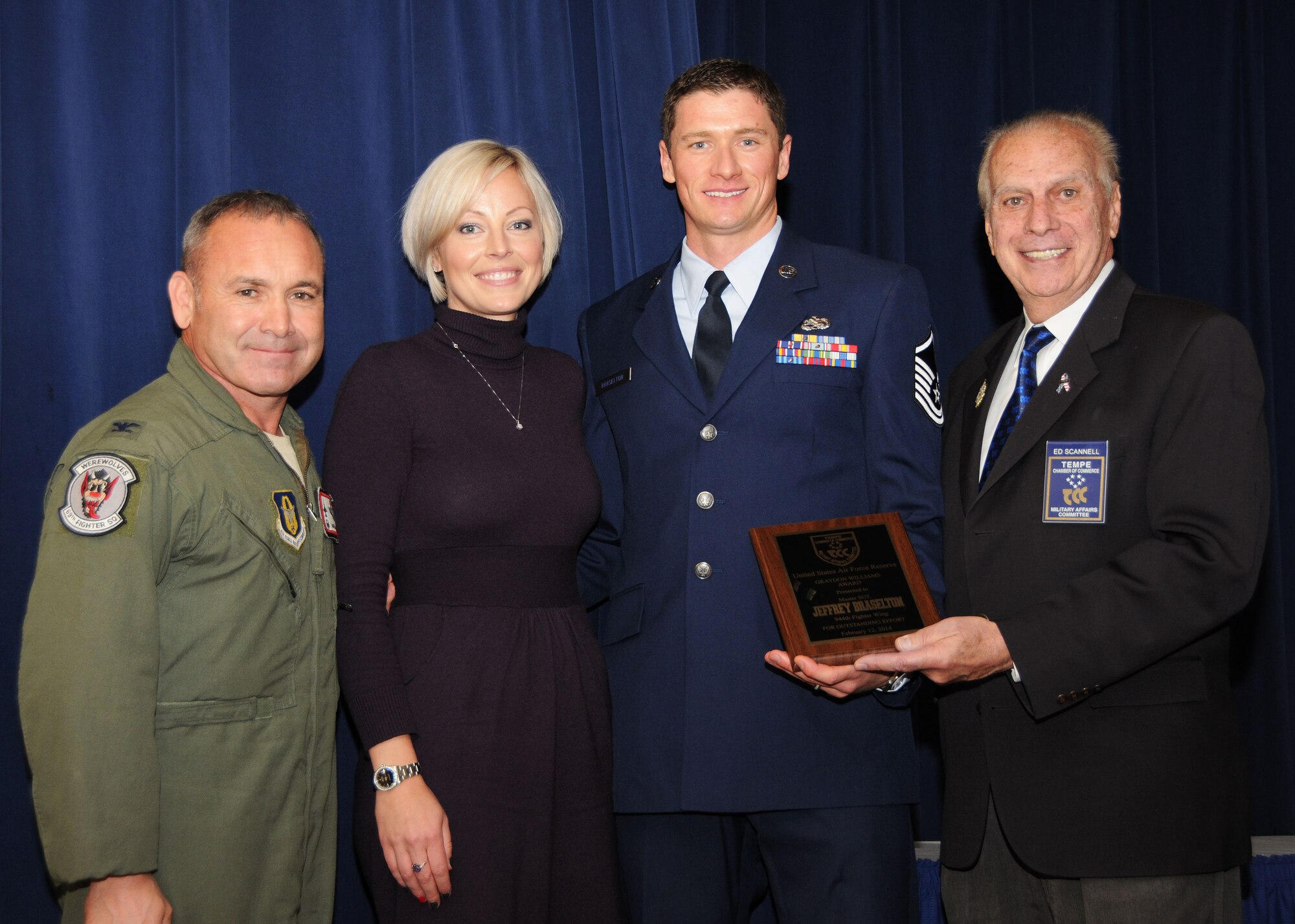 Master Sgt. Jeffrey Braselton, 944th Force Support Squadron Chief, personnel systems management, with his wife Victoria receives the Graydon Williams Award Feb. 12 during the Graydon Williams Ceremony at Club Five Six, Luke Air Force Base, Ariz. Colonel Kurt Gallegos, 944th Fighter Wing Commander and Mr. Ed Scannell, Tempe Chamber of Commerce Military Affairs Committee Chairman, present the award. (U.S. Air Force photo/Tech. Sgt. Louis Vega Jr.)
