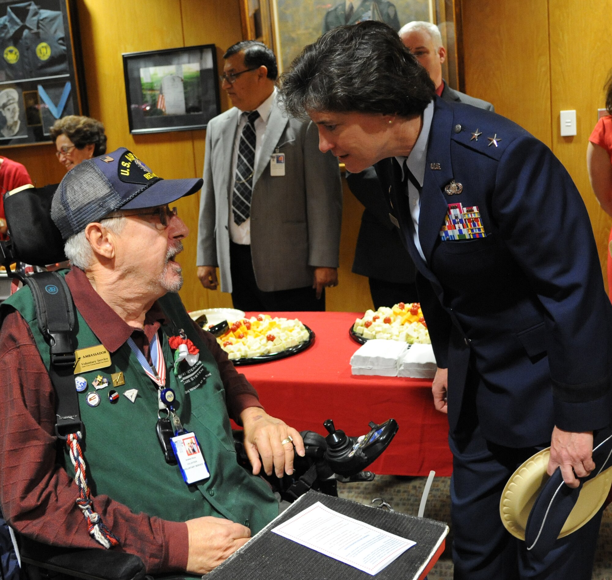 Maj. Gen. Peggy Poore, Air Force Personnel Center commander, spends time talking to Andrew Roca, Veterans Administration Voluntary Service volunteer, during the 2014 National Salute to Veteran Patients Program Feb. 14 at San Antonio's Audie L. Murphy VA Hospital. The military ambassadors and Joint Base San Antonio military 
leaders were on hand to distribute valentines and visit with veteran patients. Veterans administration facilities across the United States pay tribute to veteran patients annually during this week-long salute. 
(U.S. Air Force photo by Melissa Peterson)